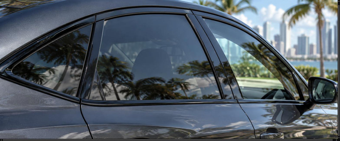 Car with gloss black chrome-delete window trim on a sunny Miami street