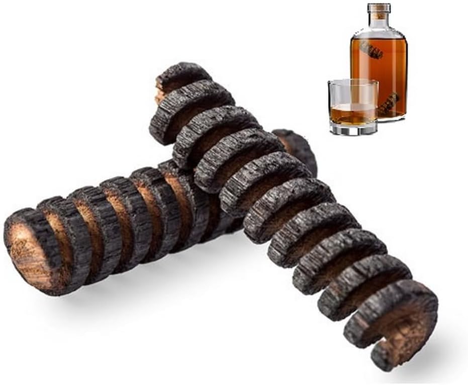 Two charred American oak infusion spirals for barrel aging whiskey in a bottle